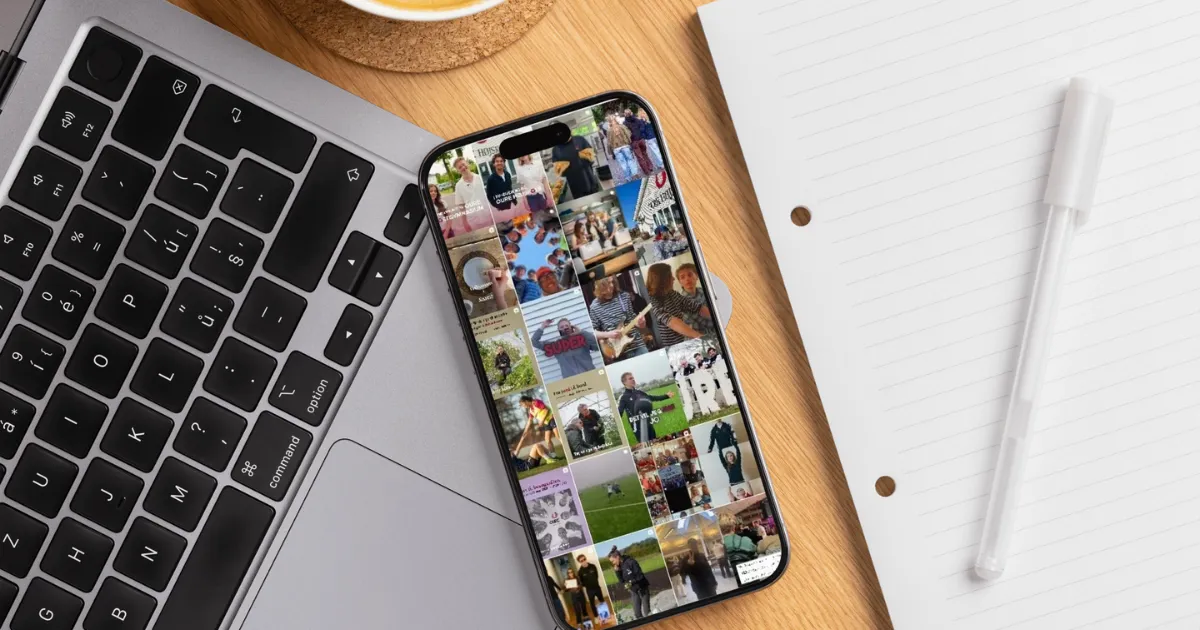 Et billede af en computer, en telefon med Oures instagram feed i, en blok og en pen
